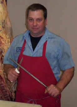 Stan Acup - Over 32 Years of Meat Cutting Experience.  He, along with The Meatman (Craig Meyer) are compiling over 10 hours of home meat processing video tapes.  Available NOW for purchase here on Ask The Meatman.com.We also sell the Red Butcher Apron that Stan is wearing in this picture. Just click on the picture to go to our Apron web page.